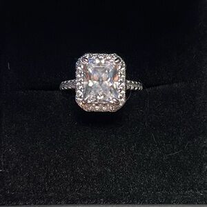 Costume ring with radiant Centerstone with halo.